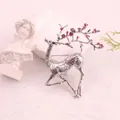 Detailed macro view of vintage silver-plated enamel deer brooch with red floral antlers - Silver Red Flower Deer (K7-2-3018) / Silver