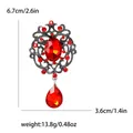 Vintage style red crystal brooch pin set in alloy with rhinestones and a teardrop pendant - Red