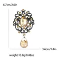 Vintage silver-toned crystal brooch with amber rhinestones and size measurements - Champagne