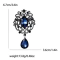 Vintage style alloy brooch pin featuring large blue crystals and teardrop pendant design - Sapphire Blue