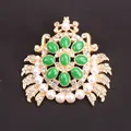 Detailed view of gold crab brooch with green stones, pearls, and crystals - Alloy Crab with Pearls / Gold Frame Emerald Green Stone