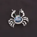 Elegant silver-toned crab brooch featuring a large blue gemstone and sparkling rhinestones - Alloy Blue Crystal Crab / Silver Frame Blue Stone