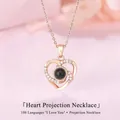 Elegante roségouden hartvormige projectieketting met 100 talen van Ik hou van jou tekst - Hart Werveling Halsketting / Eenvoudige Verpakking