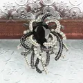 Elegante vintage kristallen broche met zwarte druppelsteen en glanzende strass-clusters - Zwarte Waterdruppel Stijl