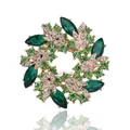 Elegant floral wreath brooch featuring green crystals and a gold-tone metal base - Dark Green Wreath