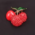Elegant red cherry brooch featuring sparkling rhinestones and green enamel leaves design - Rhinestone Lacquered Cherry Style (Q9-2-7545)