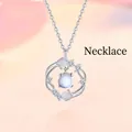 Detail of silver ginkgo leaf pendant necklace with a glowing round faux moonstone - Ginkgo Luck (Ginkgo Ring)