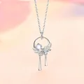 Detailed close-up of a silver necklace featuring a moonstone leaf pendant and tassels - Youthful Elegance (Ring Tassel)