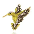 Elegante vintage gouden kolibrie broche versierd met fonkelende gele en witte strass steen - Geel en Wit Strass Gouden Basis