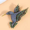 Elegante vintage gouden kolibrie broche bezet met blauwe en groene strass-steentjes - Donkerblauw en Groen Strass Antiekgoud