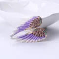 Elegant purple and gold angel wing brooch with colorful sparkling rhinestones - Gold Purple
