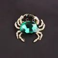 Luxury crab brooch pin with large emerald green crystal and sparkling rhinestones - Green Gem Gold Crab