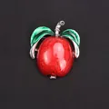 Vibrant red apple brooch with green leaves and enamel finish on black background - Red (Apple Shape)