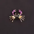 Gold-tone crab brooch featuring black enamel and sparkling pink rhinestone claws - Black Pink Enamel Crab