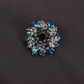 Elegant wreath brooch pin featuring blue marquise crystals and black rhinestones - Black & Blue Leaf Wreath (K6-1-2614) / 5.5cm (2.17inch)
