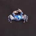 Stunning blue enamel crab brooch accessory with refined gold-toned metal plating - Sky Blue Enamel Gold Crab
