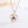 Close-up of rose gold heart projection necklace with sparkling crystal accents - 1 Piece/Pack (Simple Packaging) / Rose Gold