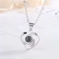 Detailed view of a silver heart projection necklace with 100 languages I love you stone - 1 Piece/Pack (Simple Packaging) / Silver
