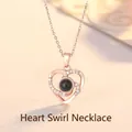 Detailed view of rose gold heart pendant with black projection stone and crystal accents - Love Vortex Style / Simple Packaging