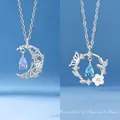 Zilveren maan en vlinder hanger ketting met elegante blauwe waterdruppel kristallen - Floating water moon + butterfly love flower / Eenvoudige Verpakking