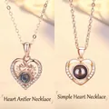Two rose gold heart projection necklaces featuring antler and simple heart designs - Heart Antler and Simple Heart Set
