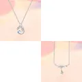 Detail of elegant silver necklace with wing pendant and pearl drop charms - 2-Piece Set (Wings + Pearl)
