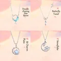 Elegante zilveren ster- en maanhalsketting met blauwe kristallen voor dames als cadeau - 4-delige set / Ster Maan + Vlinder + Planeet + Sneeuwvlok