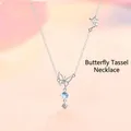 Elegant silver butterfly necklace featuring a blue moonlight bead and sparkling crystal tassel - Butterfly Tassel