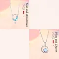 Elegante zilveren ster- en maanketting met blauw kristal en planeethanger ontwerp - 2-delige set / Ster Maan + Pluto