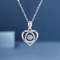 Detailed close-up of a silver heart-shaped necklace with a brilliant gemstone center - Heart Pendant / White Heart
