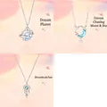 Close-up of 3-piece silver necklace set featuring planet, moon, and dreamcatcher - 3-Piece Set (Planet & Star Moon & Dreamcatcher B)