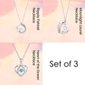 Detail view of a 3-piece silver-tone necklace set featuring whale tail and heart pendants. - Three-Piece Set / Silver-Set 8