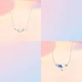 Close-up detail of silver bamboo and blue floral pendant necklaces with minimalist chains - 2-Piece Necklace Set 2 / Set of 2