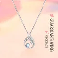 Elegant sterling silver guardian wing necklace featuring a blue moonstone pendant with crystals - Guardian Wings