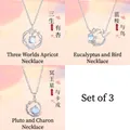 Set van 3 minimalistische zilveren kettingen met ginkgoblad-, vogel- en planeethangers - 3-delige set (Ginkgo + Vogel + Planeet)