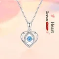 Elegant sterling silver heart pendant necklace with a blue dancing gemstone center - Iced Out Heart Pendant / Silver-Heart of Ocean