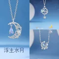 Elegante zilveren ketting met maan- en sterenmotief en blauwe kristallen hangers - Zwevende Maan + Dromerig Sterrenstelsel + Sterren Rond de Maan / Eenvoudige Verpakking