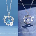 Elegante zilverkleurige kettingset met vlinderbloem- en koivishangers in blauw en wit - Vlinder & Geluks Koi / 2 Stuks (Cadeaudoos) / Zilver