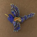 Close-up of vintage flying bird brooch with intricate blue and amber rhinestones - Flying Bird Shape (Style 2)