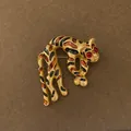 Detailed view of a vintage leopard brooch with enamel spots and red rhinestone eyes - Leopard Shape (Style 3)