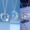 Elegante zilveren kettingen met kristallen vlinder-, maan- en bloemenhangers - Vlinder & Maan & Koi / 3 Stuks (Cadeaudoos) / Zilver