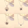 Elegante projectiehalskettingen met hart- en rendiermotieven in roségoud en zilver - 4-Delige Set (Hart Gewei, Liefde Vortex, Eenvoudig Hart, Hert)