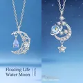 Dromerige zilveren maan en ster hanger ketting met fonkelende blauwe kristal accenten - Zwevende Maan en Dromerige Melkweg / Geschenkdoos