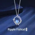 Elegante zilveren vissenstaart ketting met een stralende blauwe maansteen - Rimpeling Visstaart (Cadeaubonset)