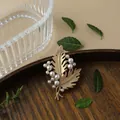 Vintage matte gold leaf brooch with elegant white pearl accents for baroque style fashion - Pearl Feather Style