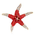 Glinsterende zeester broche met rode en witte strassteentjes in goudkleur - Rode en Witte Strass Zeester (m5-2-5020) / Zoals afgebeeld