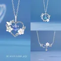 Elegante zilveren kettingen met hart-, bloem- en vlinderblauwe kristallen hangers - Hart in Bloei + Vlinder en Bloem + Eeuwige Bloem / Geschenkdoos