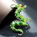 Detailed view of a green enameled Chinese dragon brooch with red and green rhinestones - Zodiac Dragon Shape (AL751580888954) / Green