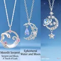 Close-up of silver-plated necklaces with snake, crescent moon, and star pendants - Snake & Moon Set (3 Pendants)