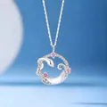 Silver-tone snake and moon circle necklace with elegant pink and clear stones. - Snake on Moon